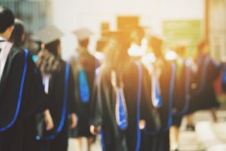 students in graduation cloaks and hats